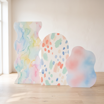 Three custom die-cut panels in different shapes - wavy, arch, and organic outline